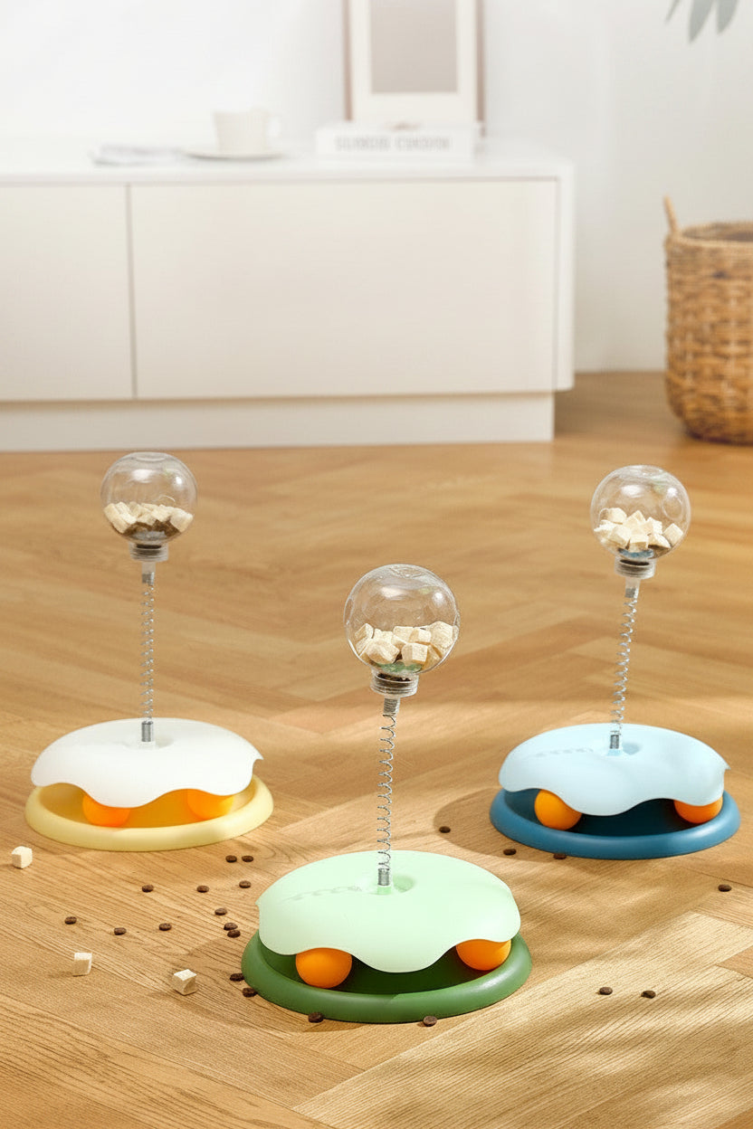 Three cat toys on a wooden surface with text indicating color options and suitability for cats.