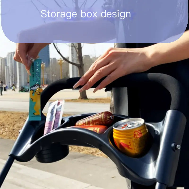 Storage box design for a baby stroller with items inside, outdoors.